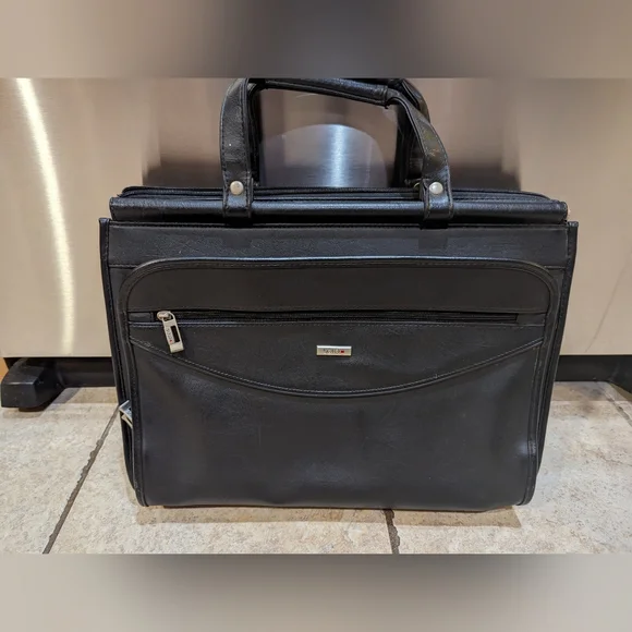 Solo brand black leather briefcase new never used. Missing shoulder strap.