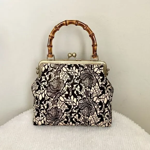 Handmade Real hair-on-horsehide Black Lace Printed Metal Frame Bamboo Handle Bag