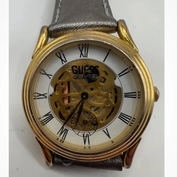Guess Gold and Silver Quartz skeleton watch