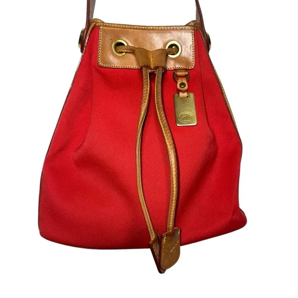 Dooney & Bourke red canvas drawstring bucket bag with tan leather accents