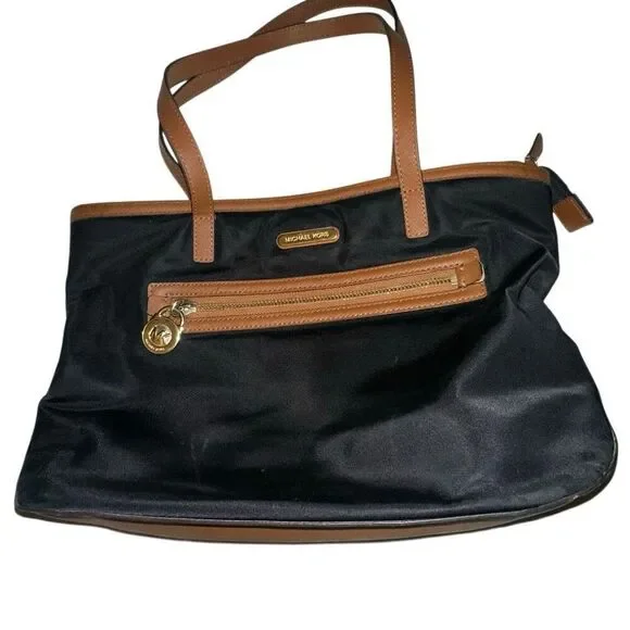 Michael kors black purse w/ tan trim 6 pockets