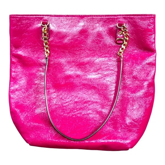 Michael Kors patent leather handbag in a sleek, glossy finish.