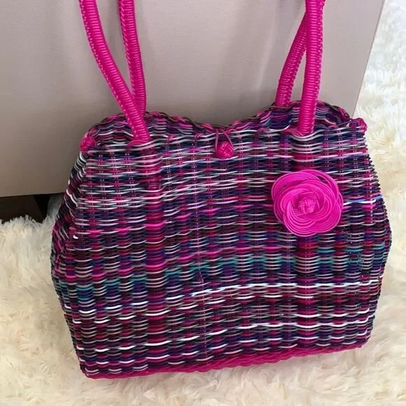 Handwoven plastic bag in multicolor with pink bottom and pink handles