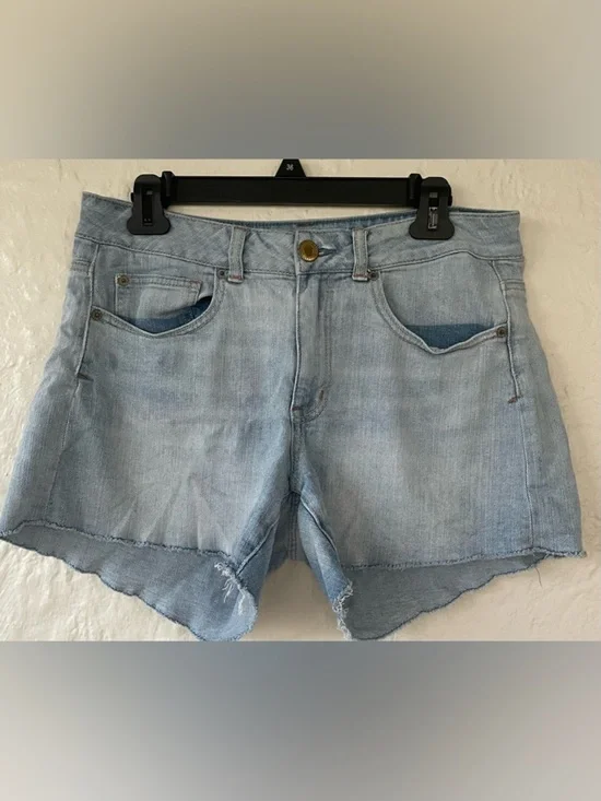 American Eagle women’s mid rise mid wash distressed hem cut off denim shorts; 10