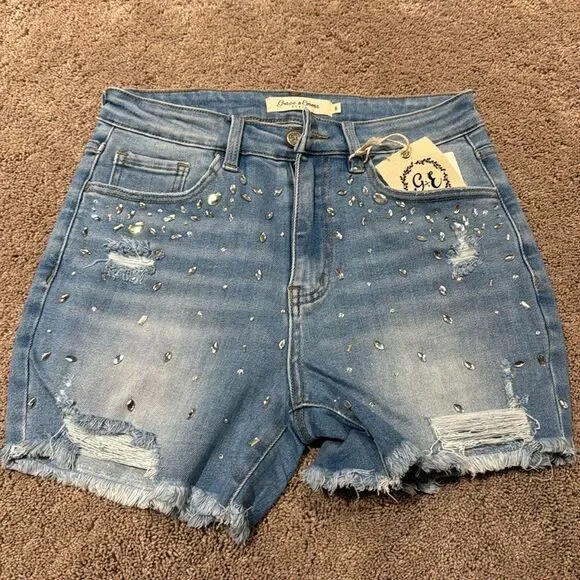 Denim jeweled shorts! With distressing and fray ! Size 6 with some stretch