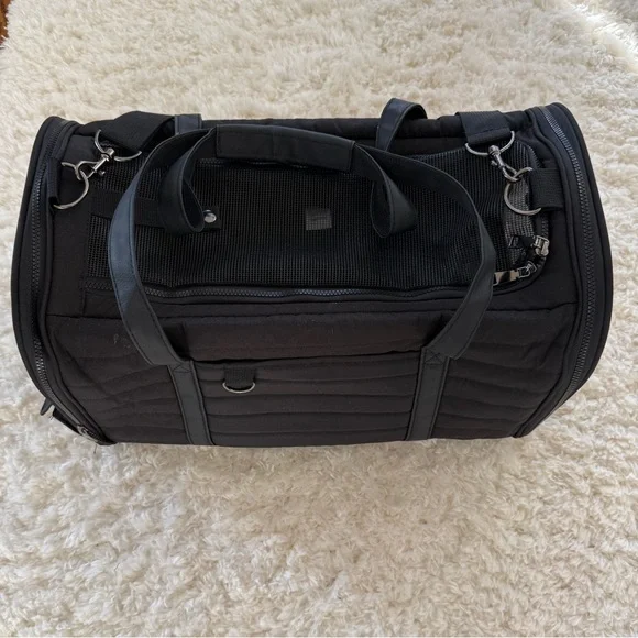 Used black soft pet carrier without interior padding