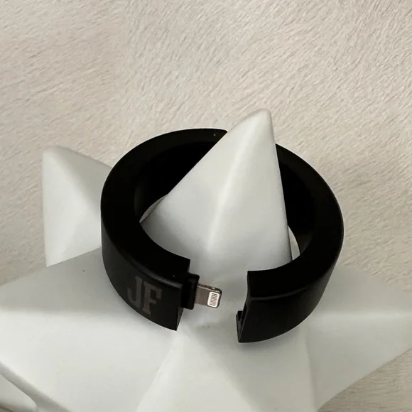 Black Charging Bracelet with JF initials on it.