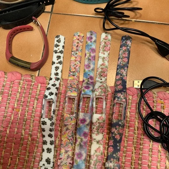 Fitbit Alta fitness tracker with charger and bands