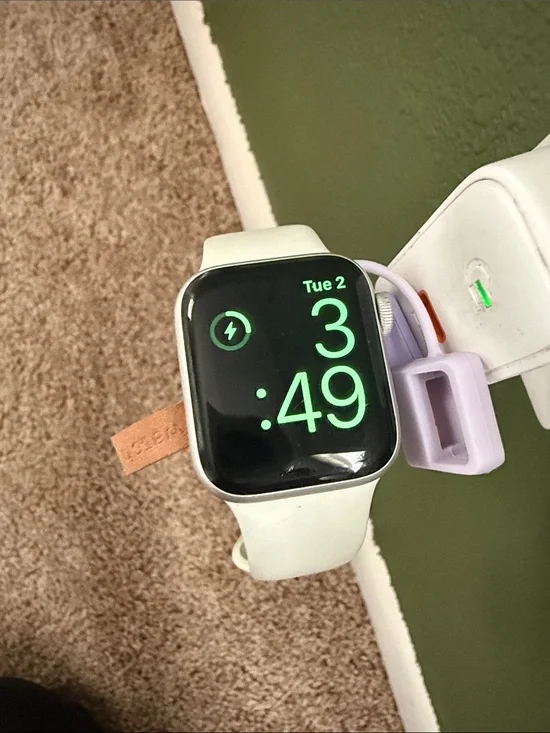 Apple Watch with White Sport Band and Lavender Charging Holder