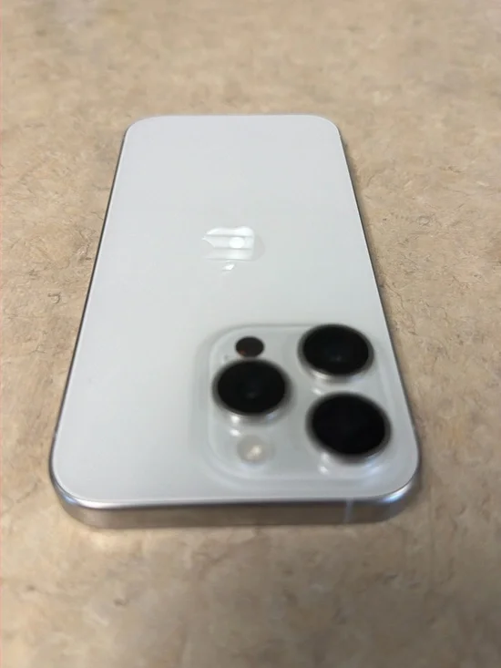 Apple iPhone 15 pro in White with Silver Frame with triple 256 GB