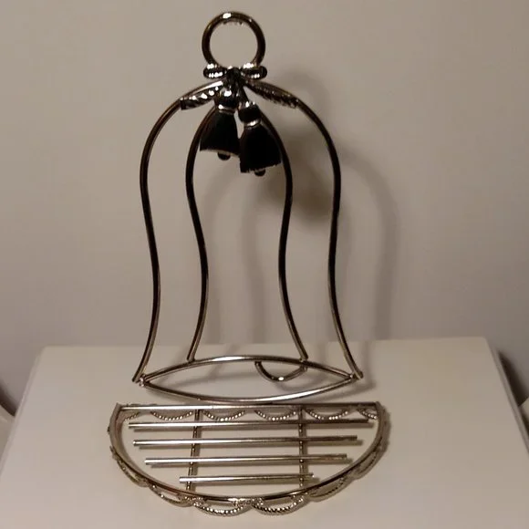 Bell shaped, gold tone metal, semi-circle shelf in excellent condition