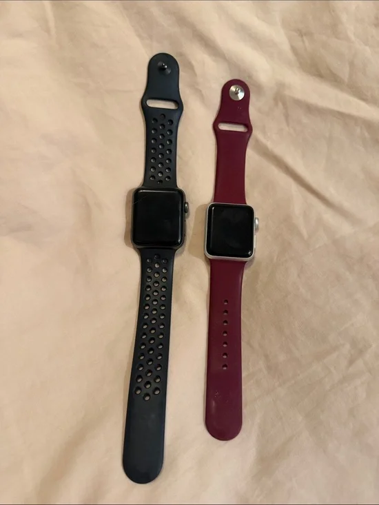 Apple Smartwatch Pair with Black Perforated Band & Burgundy Silicone Band
