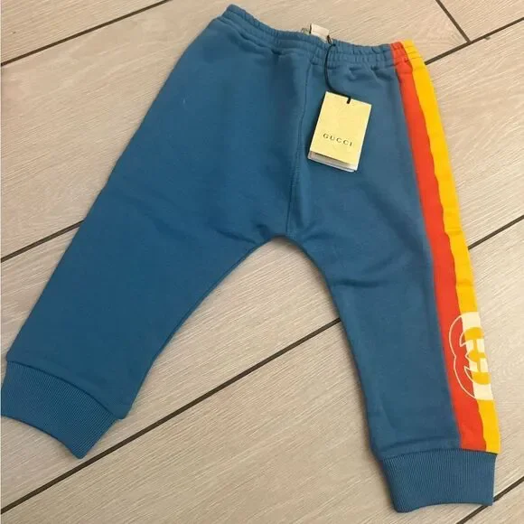Brand new Gucci Kids Blue Jogger Pants Gg logo on side size 2