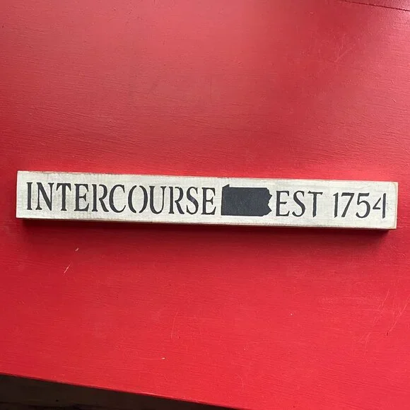 Wooden Sign with Black Text