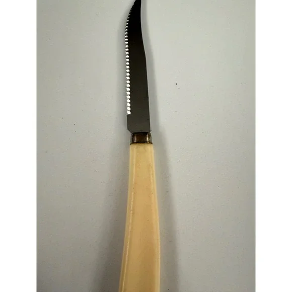 Vintage Quikut Stainless Steel Serrated Steak Knife USA Cream Handle Cutlery