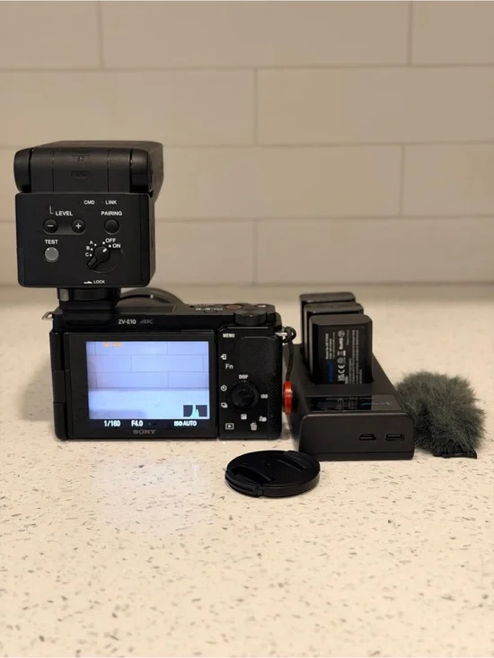 Sony ZV-E10 Mirrorless Digital Camera with External Flash Attachment