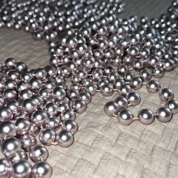 Set of 4 shiny pale metallic pink beaded garland.