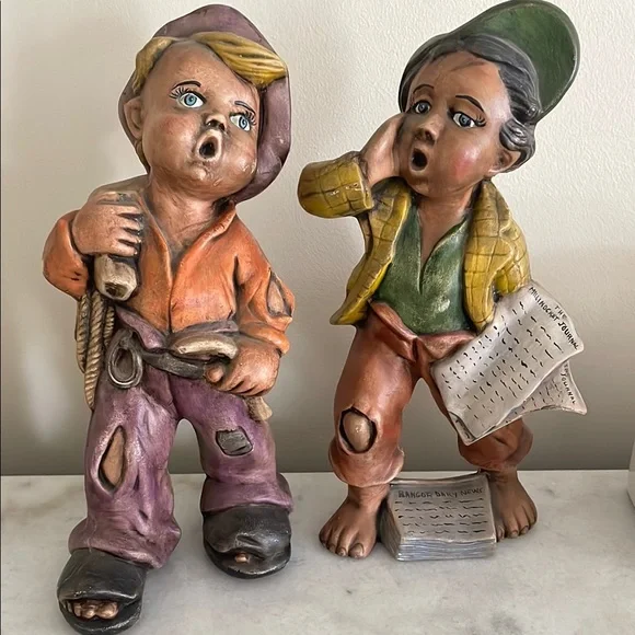 Paperboy and hobo ceramic figurines
