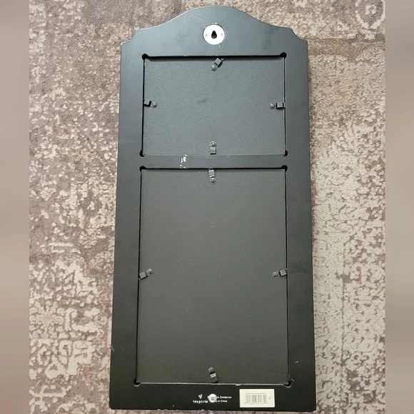 Elegant Black Wall Mirror with Floral Accent