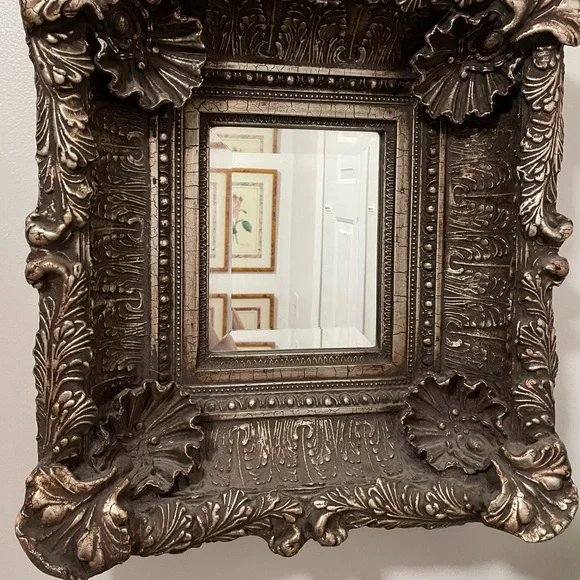 Beautiful carved mirror with little pearls in the oyster shells and much carving