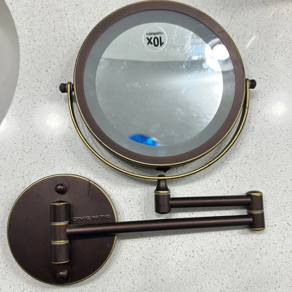 Round magnifying wall mirror
