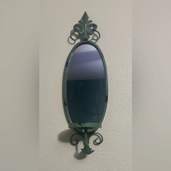 Pair of vintage metal wall mirrors with candle holders