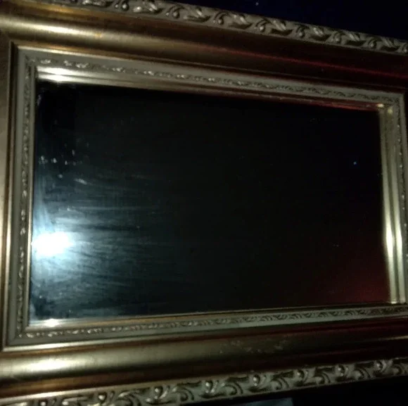 Gold framed wall mirror