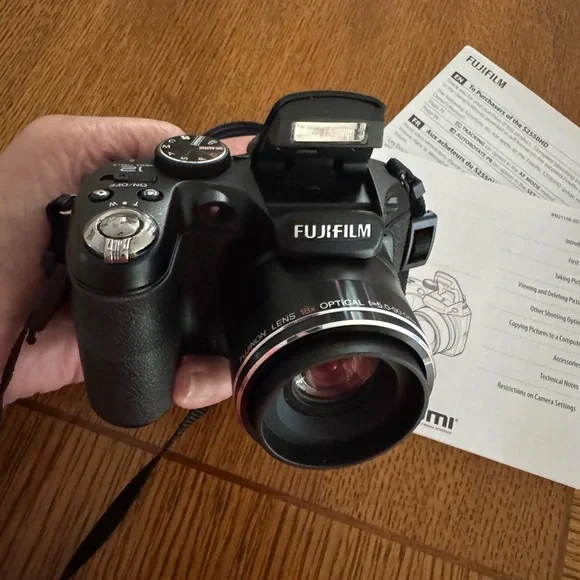 Fujifilm Black Digital Model S2550HD Camera with Zoom Lens and Ergonomic Grip.