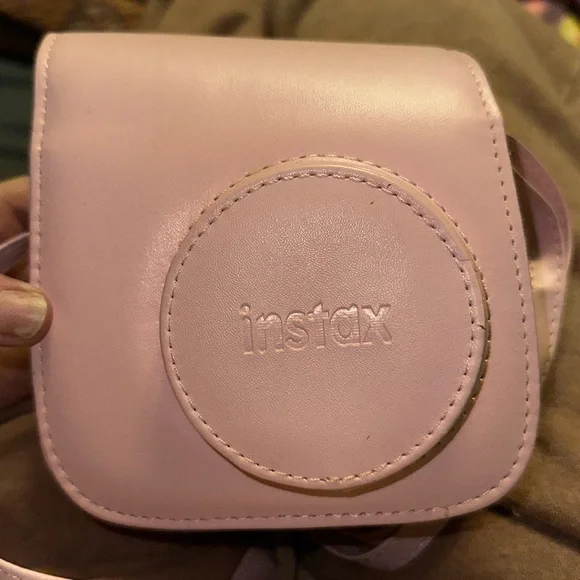 Camera Works properly. Someone painted it white though. With pink carry case .