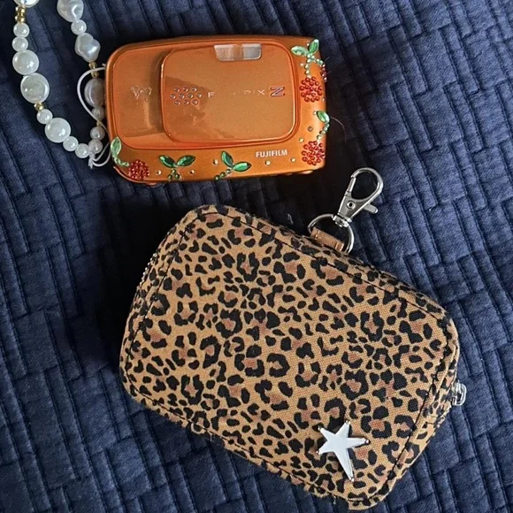 Fujifilm Orange Camera with Floral Accents and Leopard Case