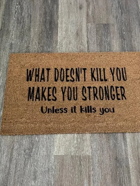 WHAT DOESN'T KILL YOU MAKES YOU STRONGER Unless it kills you decorative doormat