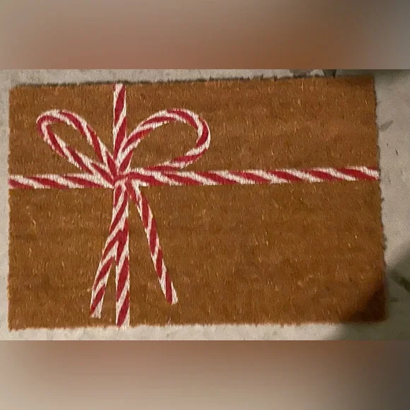 Brown Doormat with Red and White Bow Design
