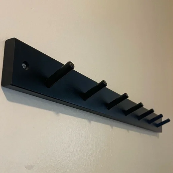 Black Coat Rack. 24” wide x 2” tall. Almost 3” between hooks.