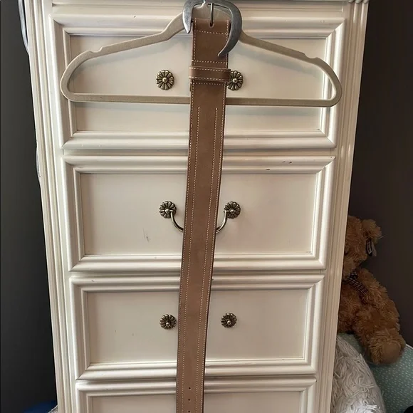 Free People Tan with Silver buckle wide belt. The buckle is unique.