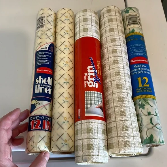 Five rolls of Rubbermaid shelf liner, some adhesive some not 3 full new rolls