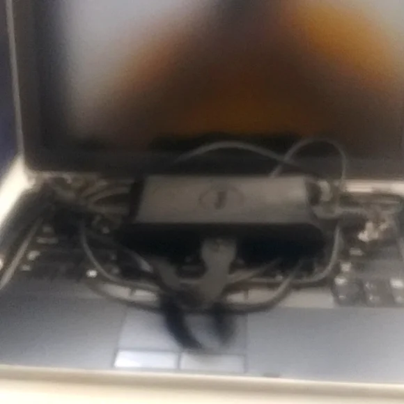 A 2012 Dell Latitude E6430 Notebook, black and gray, 14