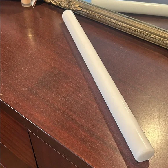 Plastic rolling pin approximately 20”