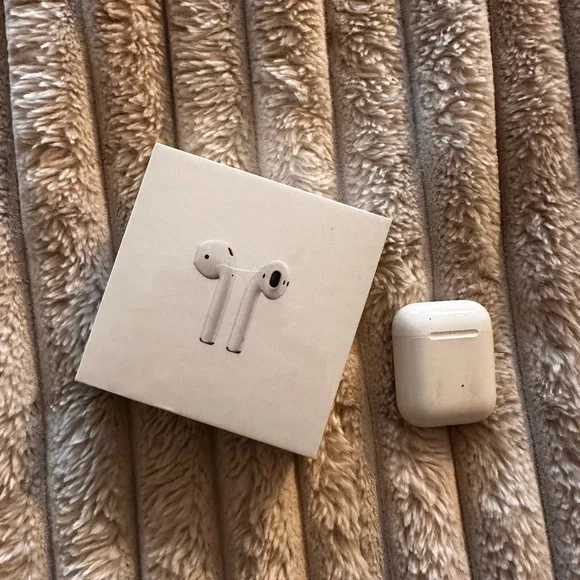 (1) brand new AirPods (1) second hand AirPods total of 2