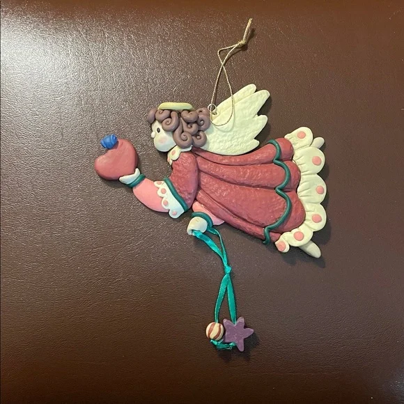 Flying Angel holding a heart Christmas ornament