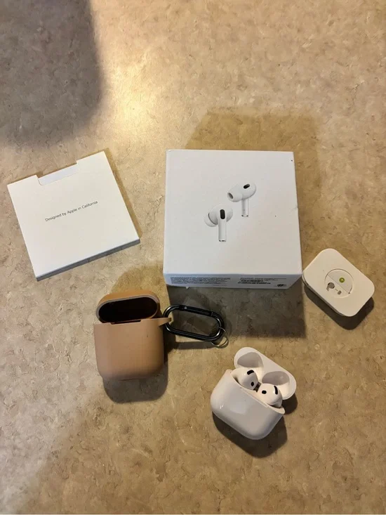 Apple AirPods Pro with White Earbuds and Tan Silicone Case