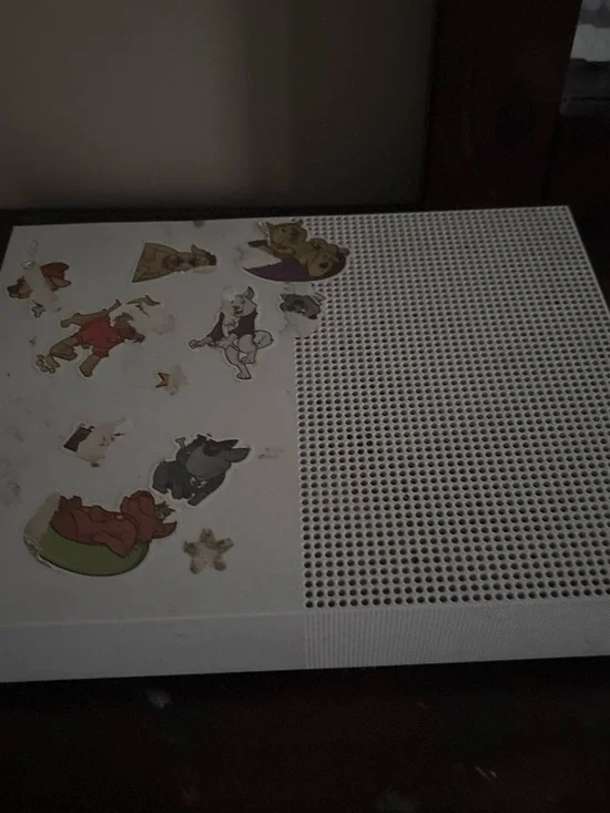 White Gaming Console with Decorative Stickers