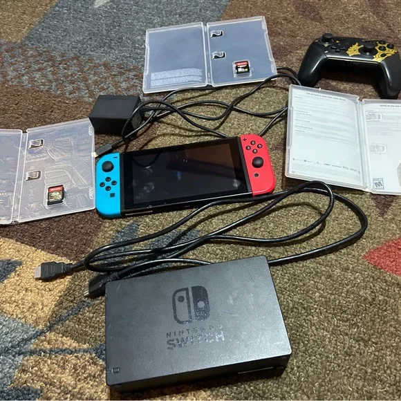 Nintendo Switch Console with Red and Blue Joy-Con and Accessories
