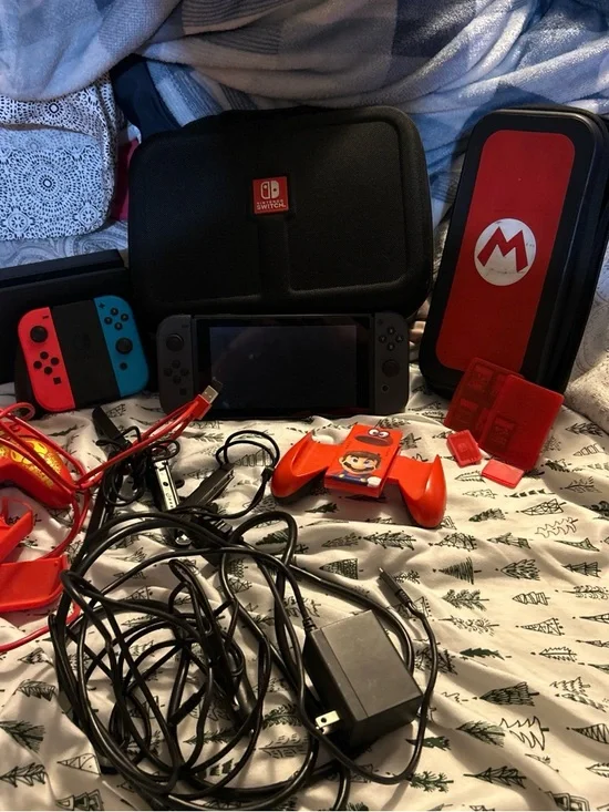Nintendo Switch Console with Red/Blue & Gray Joy‑Con and Red Accessories