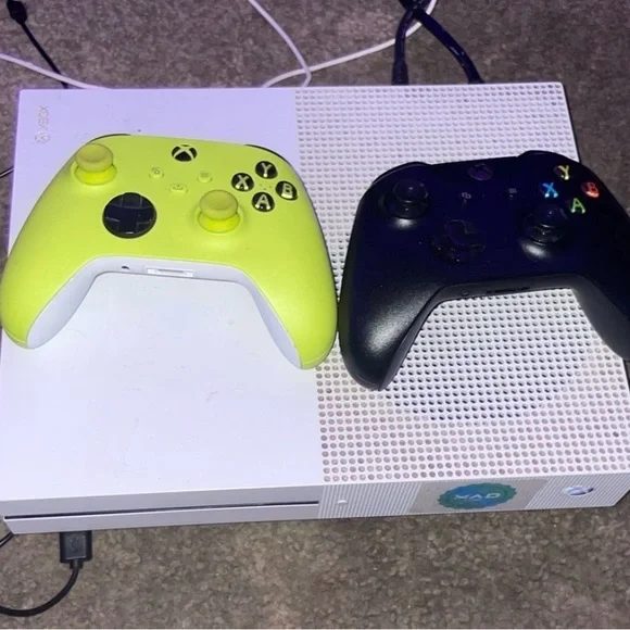Console with White and Black Controllers