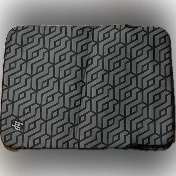 HP Reversible 14.1-inch Laptop Sleeve with a grey geometric pattern