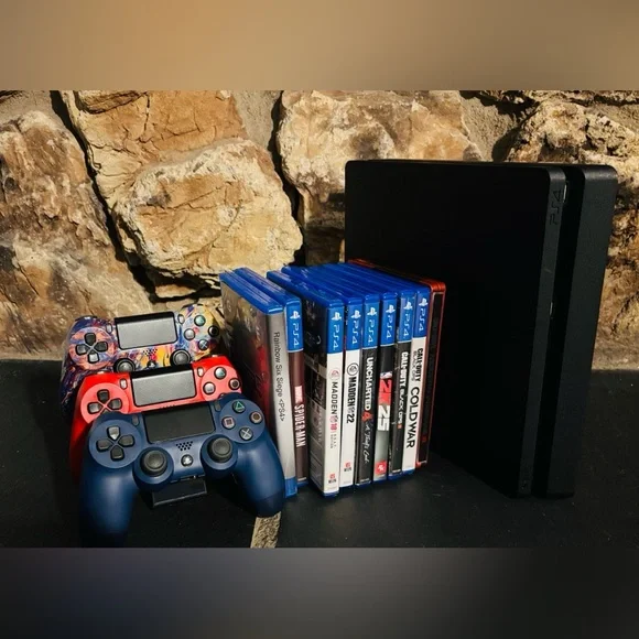 Sony PS4 Slim 1TB with 3 controllers and Game Collection