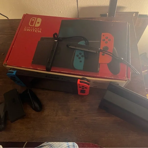 Nintendo Switch Console with Red and Blue Controllers