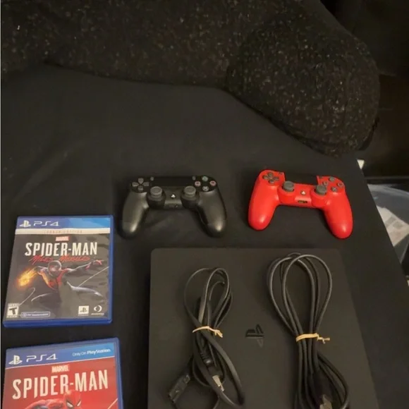 Sony PlayStation 4 with Black and Red Controllers