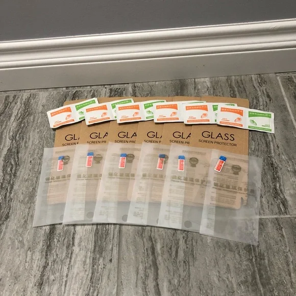 Six pack of iPhone 5s glass screen protectors with wipes to clean phone & screen