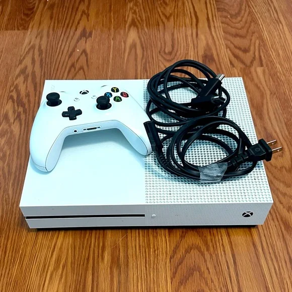 Microsoft xbox one console, controller, and hdmi cable.